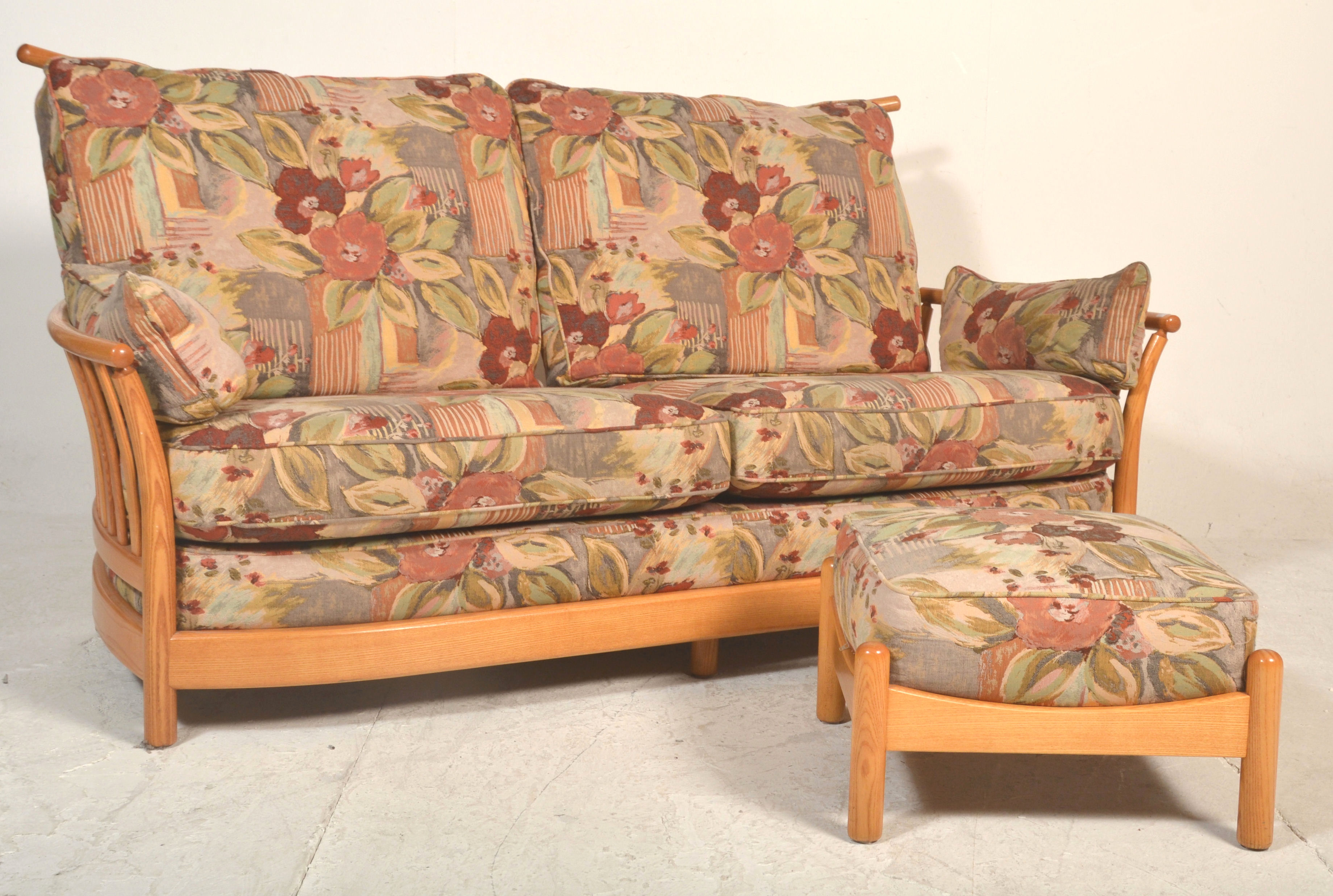 A good Ercol Saville light elm three seater sofa s