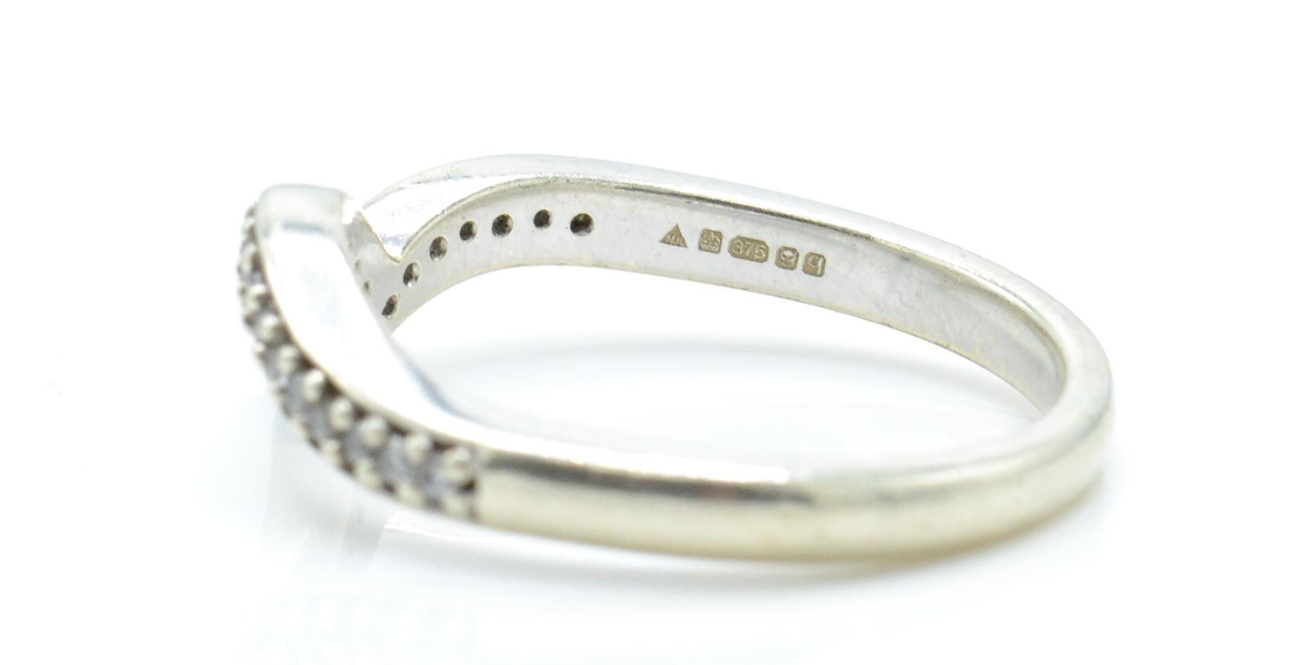 A hallmarked 9ct white gold and diamond wishbone ring. - Image 4 of 4