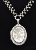 A large 19th century Victorian silver hallmarked locket and collar chain