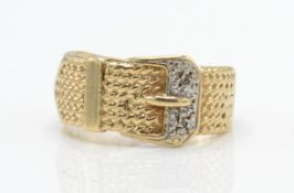 A hallmarked 9ct gold and diamond buckle ring.