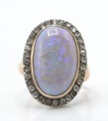 A 9ct rose gold opal and diamond ring.
