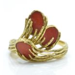 A hallmarked 18ct gold and coral ' comet ' ring.