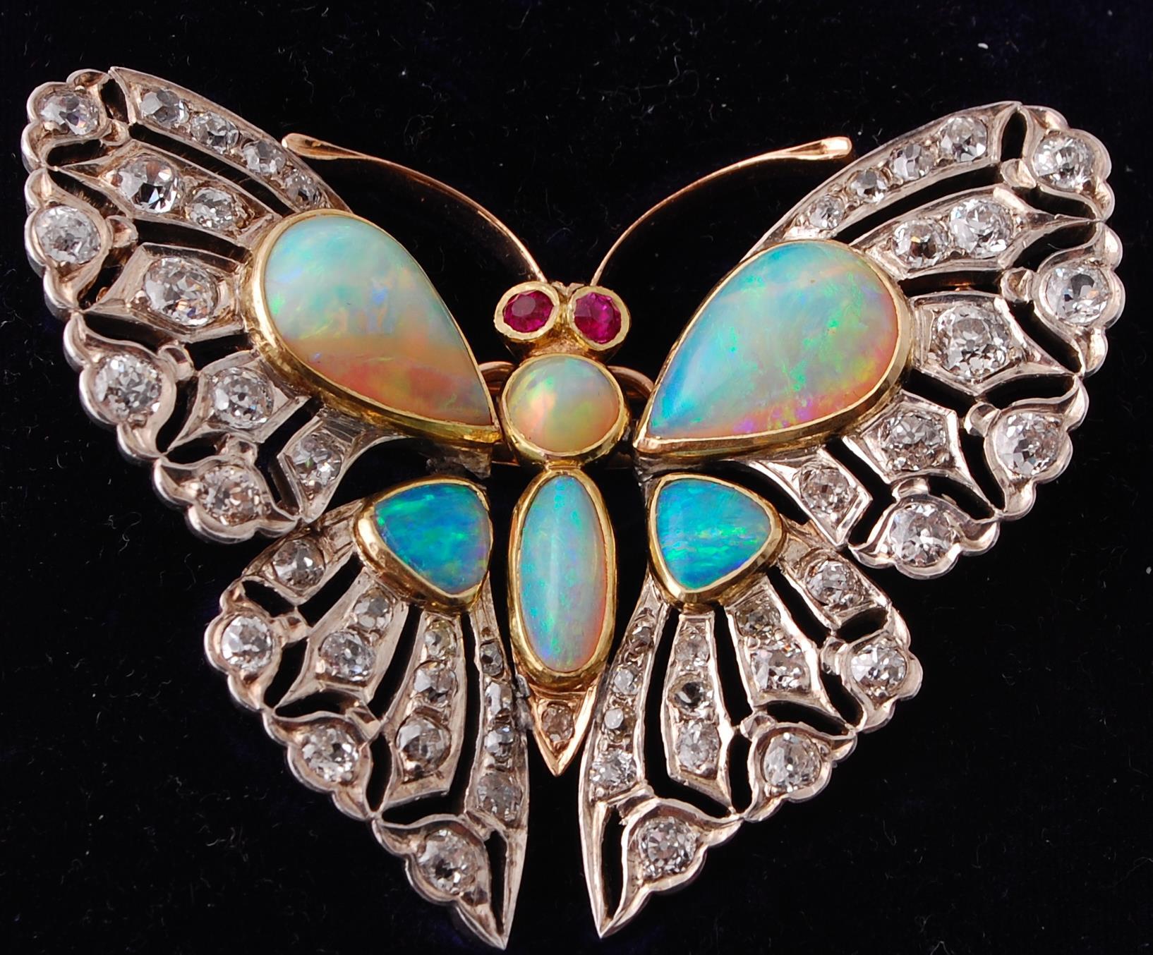 An Edwardian opal, ruby and diamond butterfly pendant brooch.