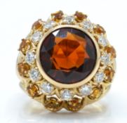A French 18ct gold citrine and diamond sunflower ring.