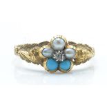 An antique gold pearl turquoise and diamond ring. The ring being set with a central rose cut diamond