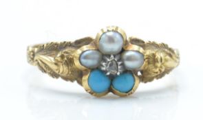 An antique gold pearl turquoise and diamond ring. The ring being set with a central rose cut diamond
