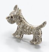 18ct white gold diamond & ruby figural brooch pin. The brooch in the form of a Highland Terrier