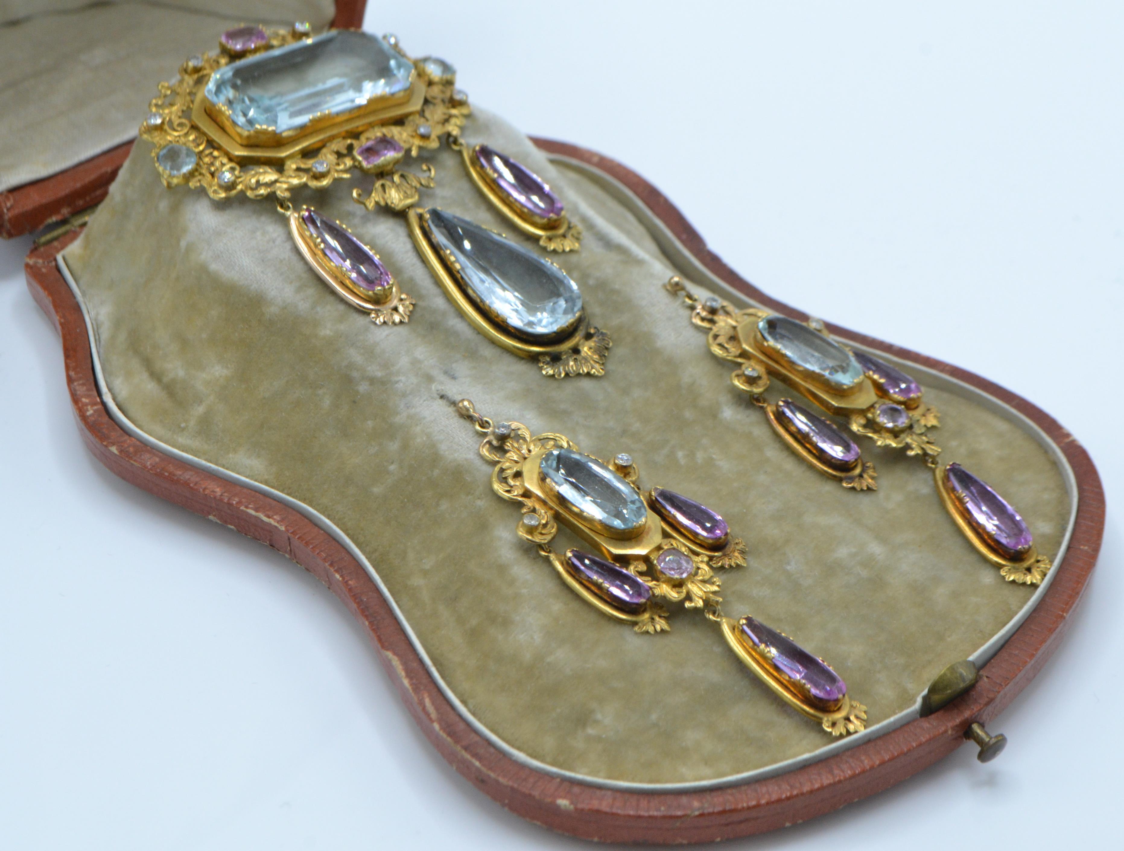 A cased 19th century gold, aquamarine, pink topaz and diamond brooch and earring suite.