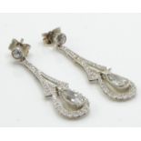 A pair of Edwardian 18ct white gold and diamond drop earrings