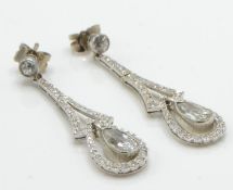 A pair of Edwardian 18ct white gold and diamond drop earrings