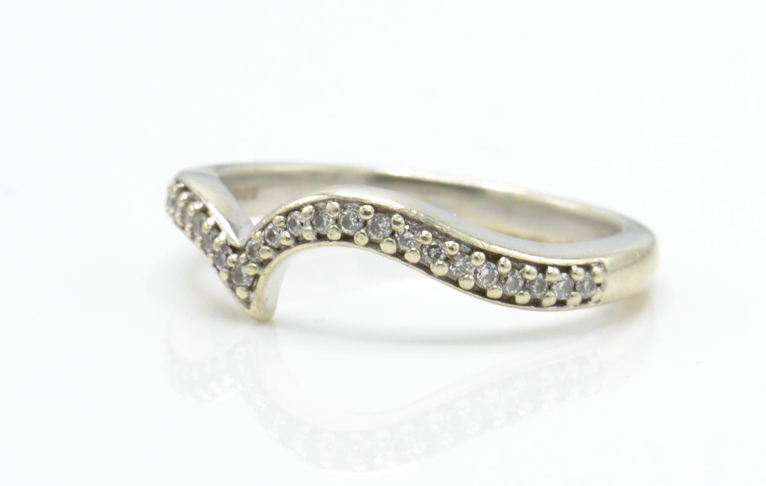 A hallmarked 9ct white gold and diamond wishbone ring. - Image 2 of 4