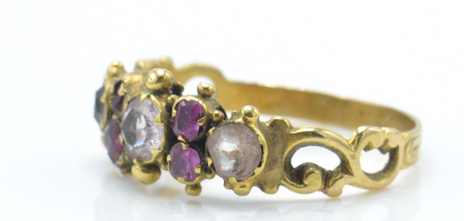 An antique gold ruby and coloured stone ring. The ring being set with ruby, white and red and pink - Image 2 of 4