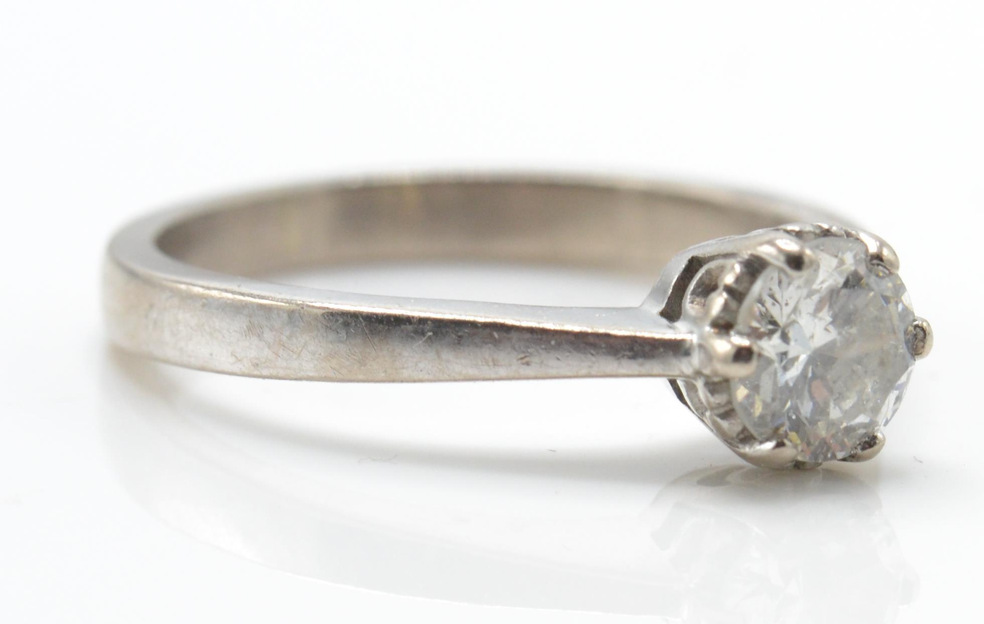 A hallmarked 18ct white gold and diamond solitaire ring. The ring set with a round brilliant cut dia - Image 4 of 4