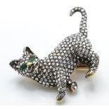 A gold emerald and diamond figural brooch pin. The brooch in the form of a cat