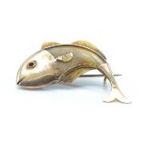 A vintage gold and horn figural brooch pin. The brooch on the form of a fish having a horn body