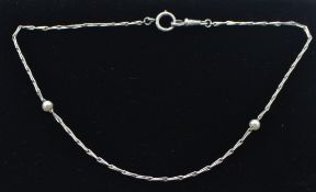 A French 18ct white gold and pearl necklace. French import marks