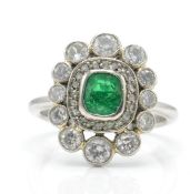 A Hallmarked Platinum Emerald & Diamond Cluster Ring