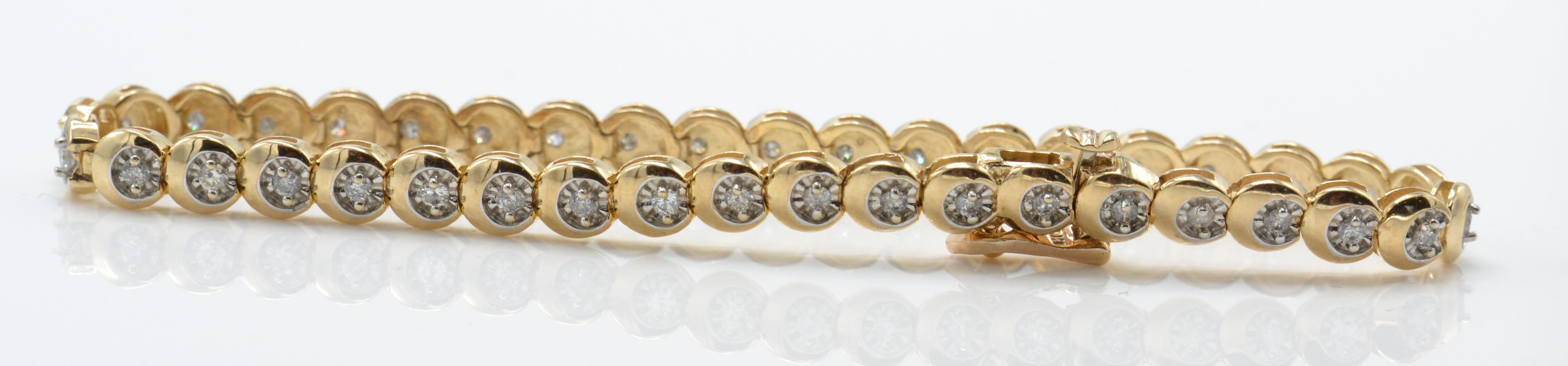 A hallmarked 9ct gold and diamond tennis bracelet with 40 brilliant cut diamonds