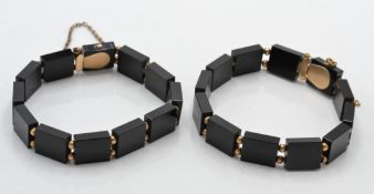 A pair of antique early 20th century mourning bracelets Each with black glass links set with 9ct
