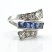 A platinum sapphire and diamond Art Deco cross over fan ring