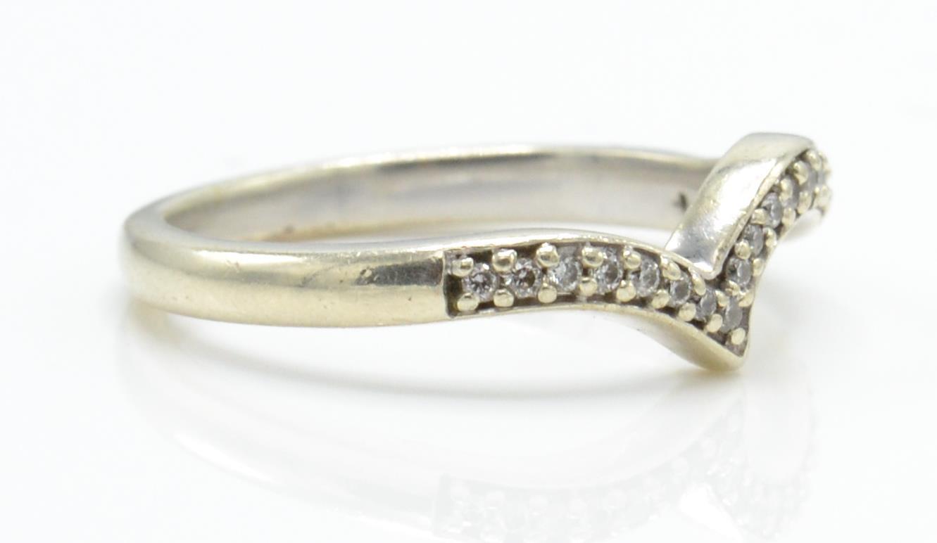 A hallmarked 9ct white gold and diamond wishbone ring. - Image 3 of 4
