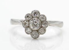 An 18ct white gold and diamond cluster ring. Estimated diamond weight 1.0ct