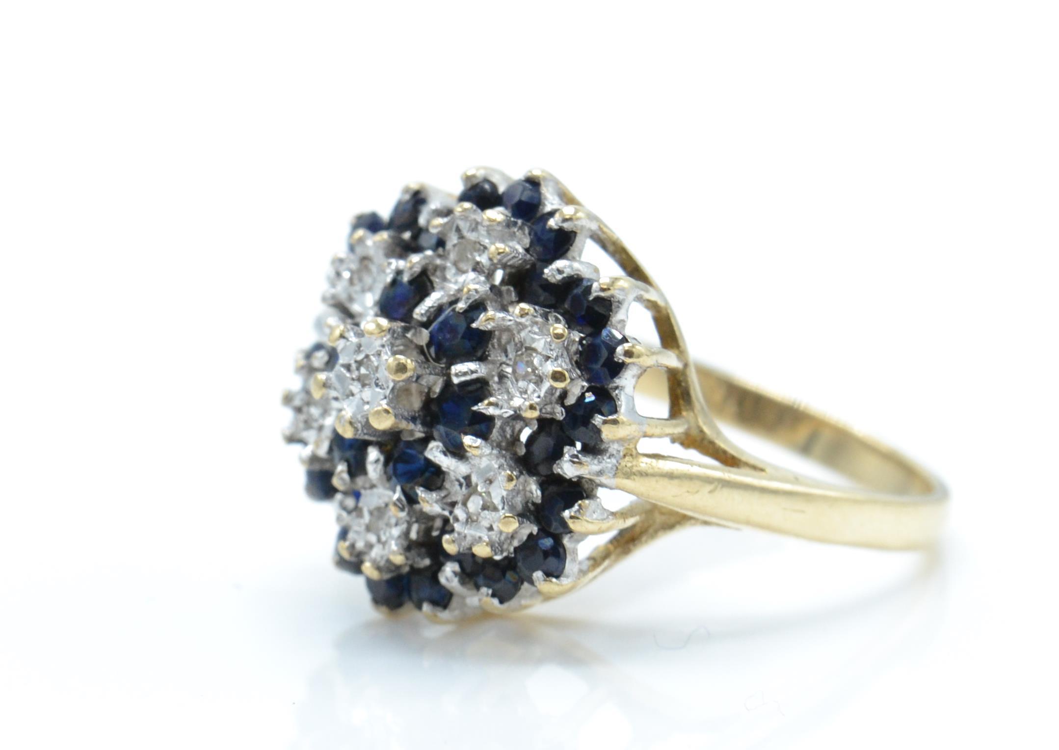 A hallmarked 9ct gold sapphire and diamond cluster ring. - Image 2 of 4