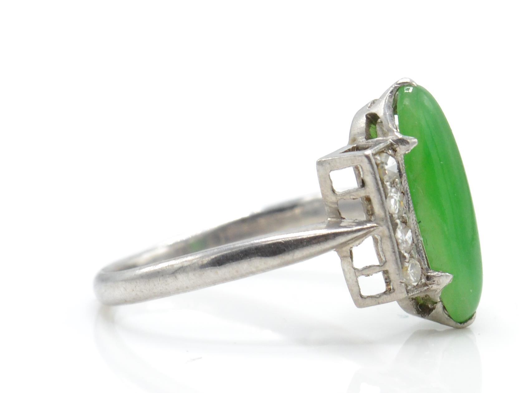 An Art Deco platinum, diamond and nephrite ring. The ring set with a green cabochon possible - Image 3 of 3