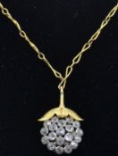 An 18ct gold and diamond pendant necklace. The necklace strung with a pendant in the form of a berry
