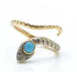 An antique turquoise and diamond snake ring. The ring in the form of a coiled snake