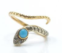 An antique turquoise and diamond snake ring. The ring in the form of a coiled snake