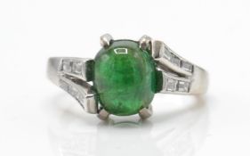 20ct white gold emerald and diamond ring. The ring set with an emerald cabochon