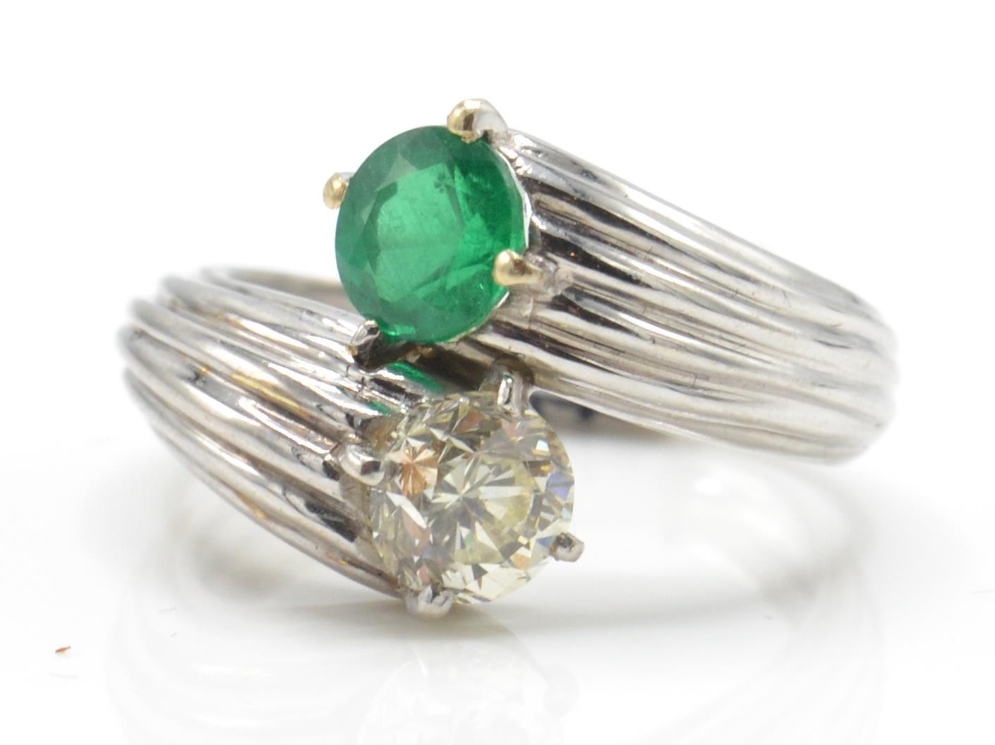 An emerald and diamond toi et moi ring. Estimated diamond weight 0.70cts - Image 3 of 6