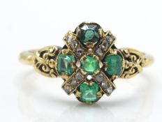 An antique 18ct hallmarked emerald and diamond ring. The ring set with 5 emeralds and rose cut