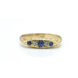 A 9ct gold sapphire and diamond gypsy ring