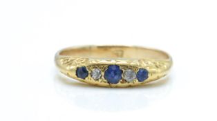 A 9ct gold sapphire and diamond gypsy ring