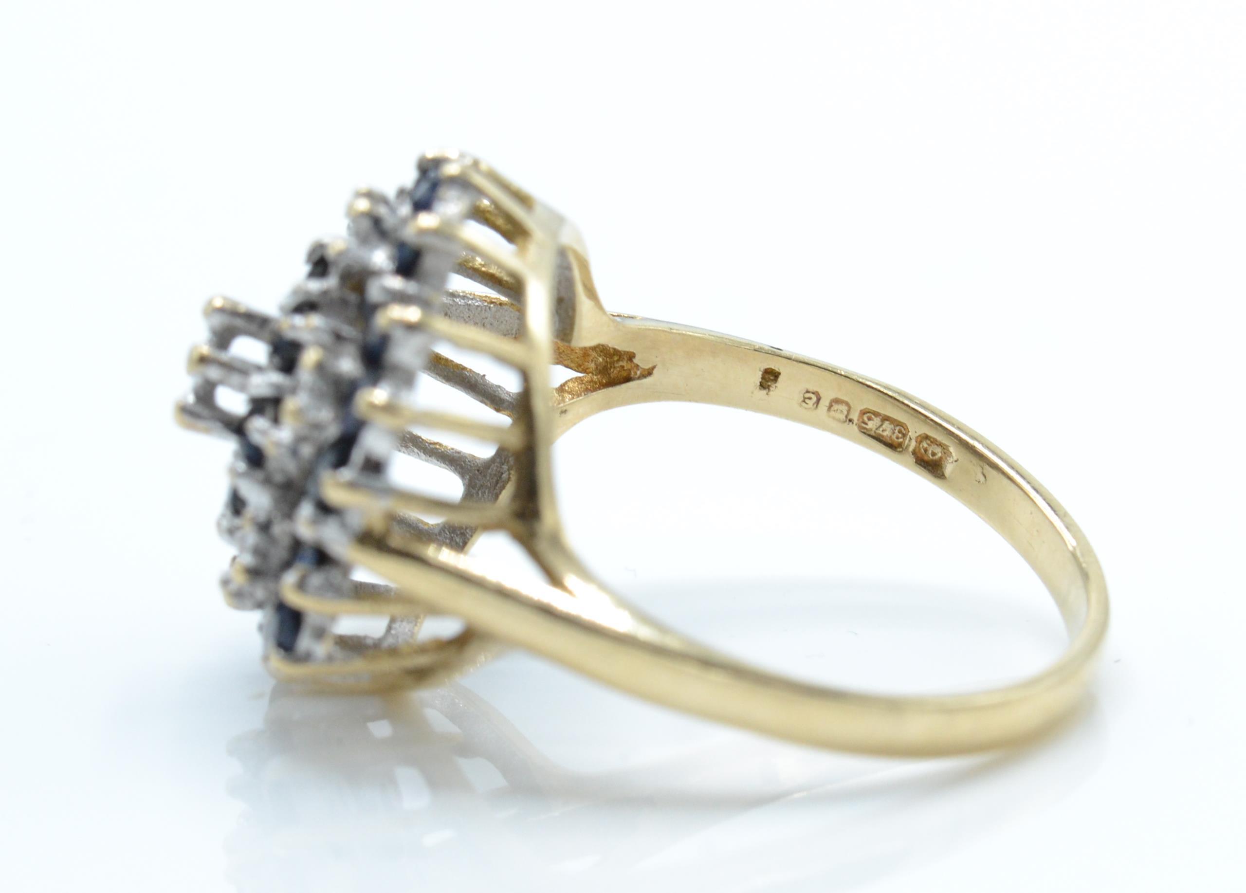 A hallmarked 9ct gold sapphire and diamond cluster ring. - Image 4 of 4