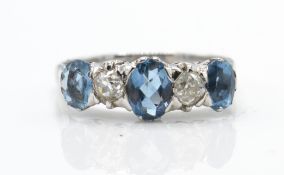An 18ct white gold aquamarine and diamond five stone ring.