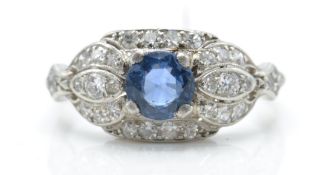 An 18ct white gold diamond and sapphire dome ring.