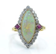 A French 18ct gold opal diamond and ruby ring.