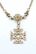 A 9ct gold cruciform pendant and necklace chain. The necklace strung with twin cruciform pendants