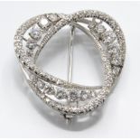 An 18ct white gold and diamond brooch pin. The brooch being set with elliptical arches