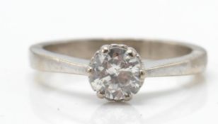 A hallmarked 18ct white gold and diamond solitaire ring. The ring set with a round brilliant cut dia