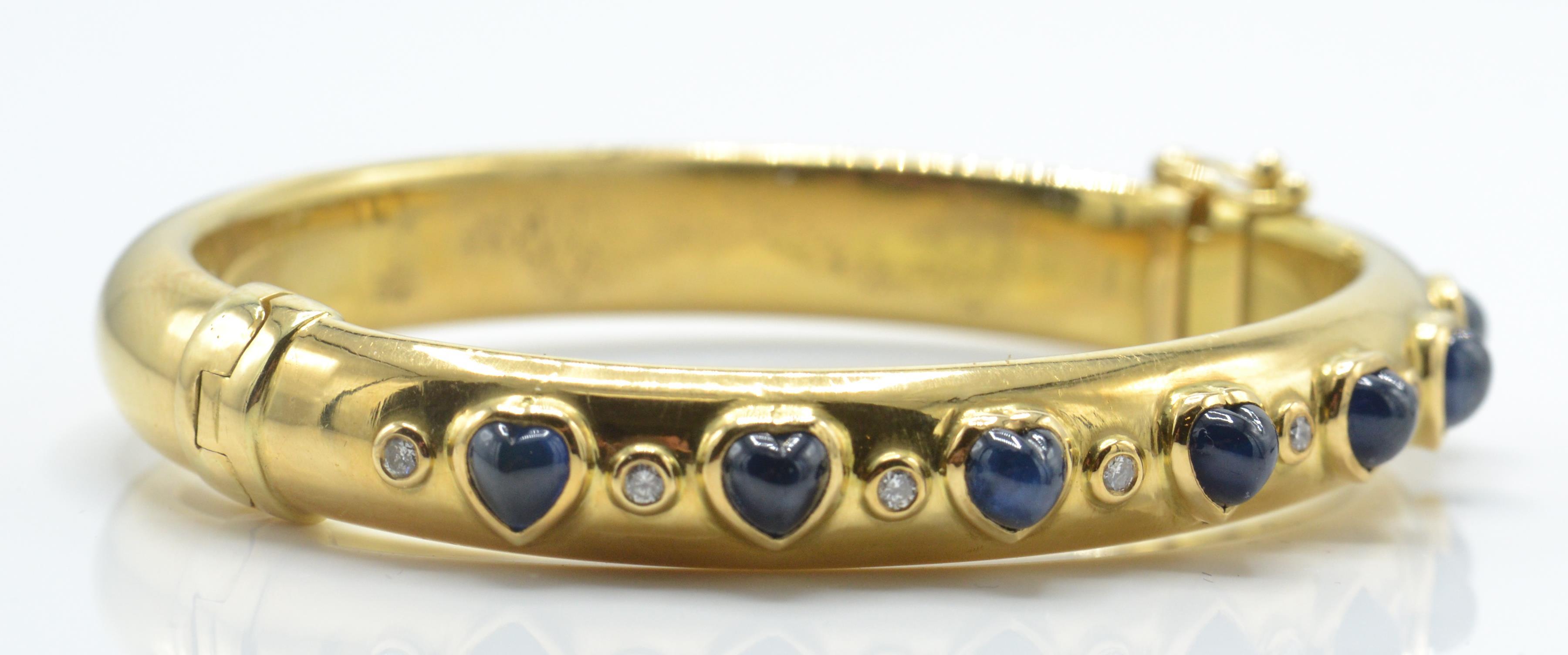 An 18ct gold sapphire and diamond bangle. The bangle set with heart shaped sapphire cabochons - Image 5 of 5