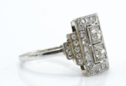 A French 18ct gold and platinum Art Deco panel ring. Estimated diamond weight .80cts