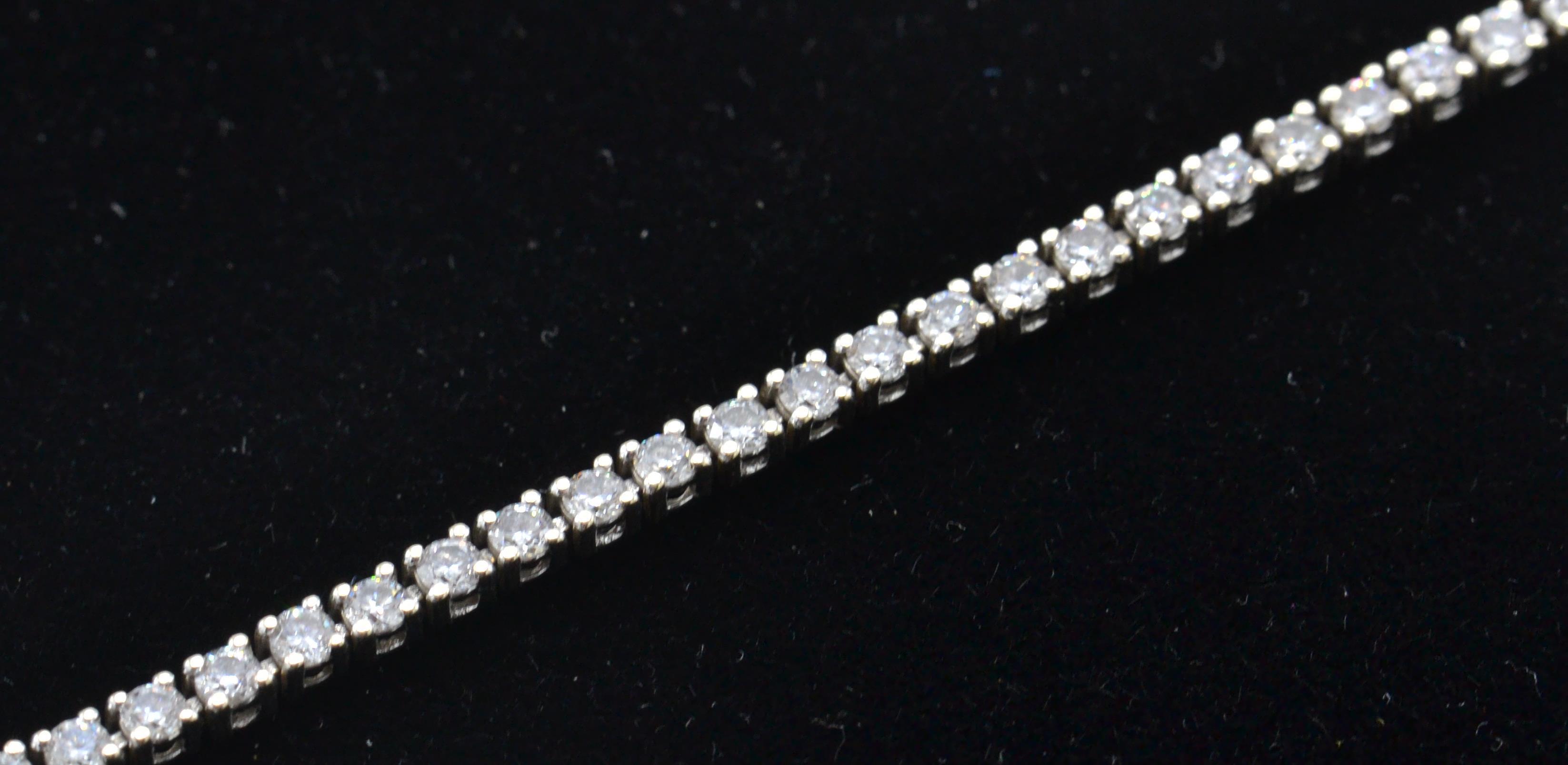 An 18ct white gold tennis bracelet set with round - Image 8 of 8