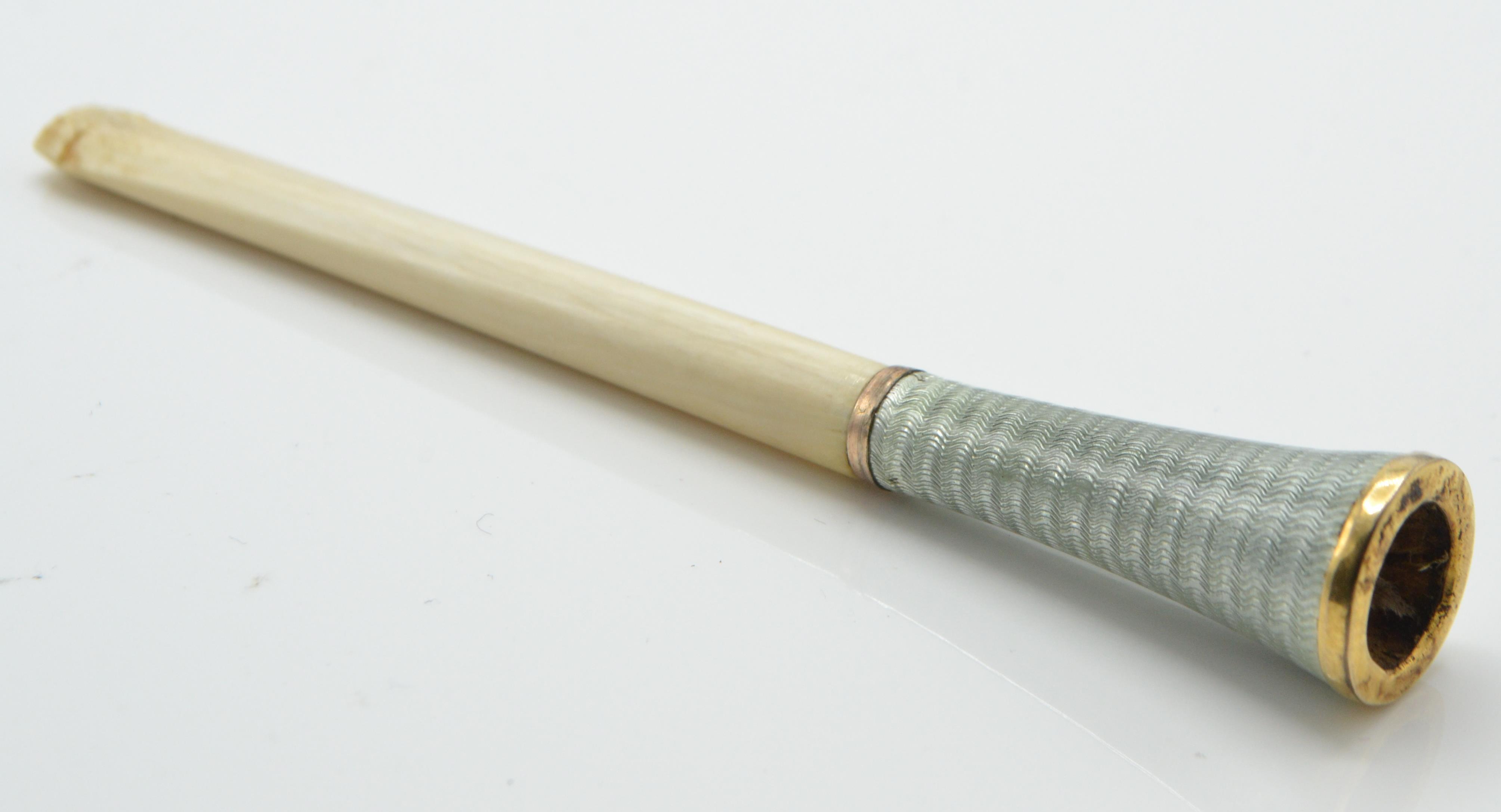 A 1930's Art Deco guilloche enamelled ivory cigarette holder. The ivory neck with enamelled - Image 2 of 5