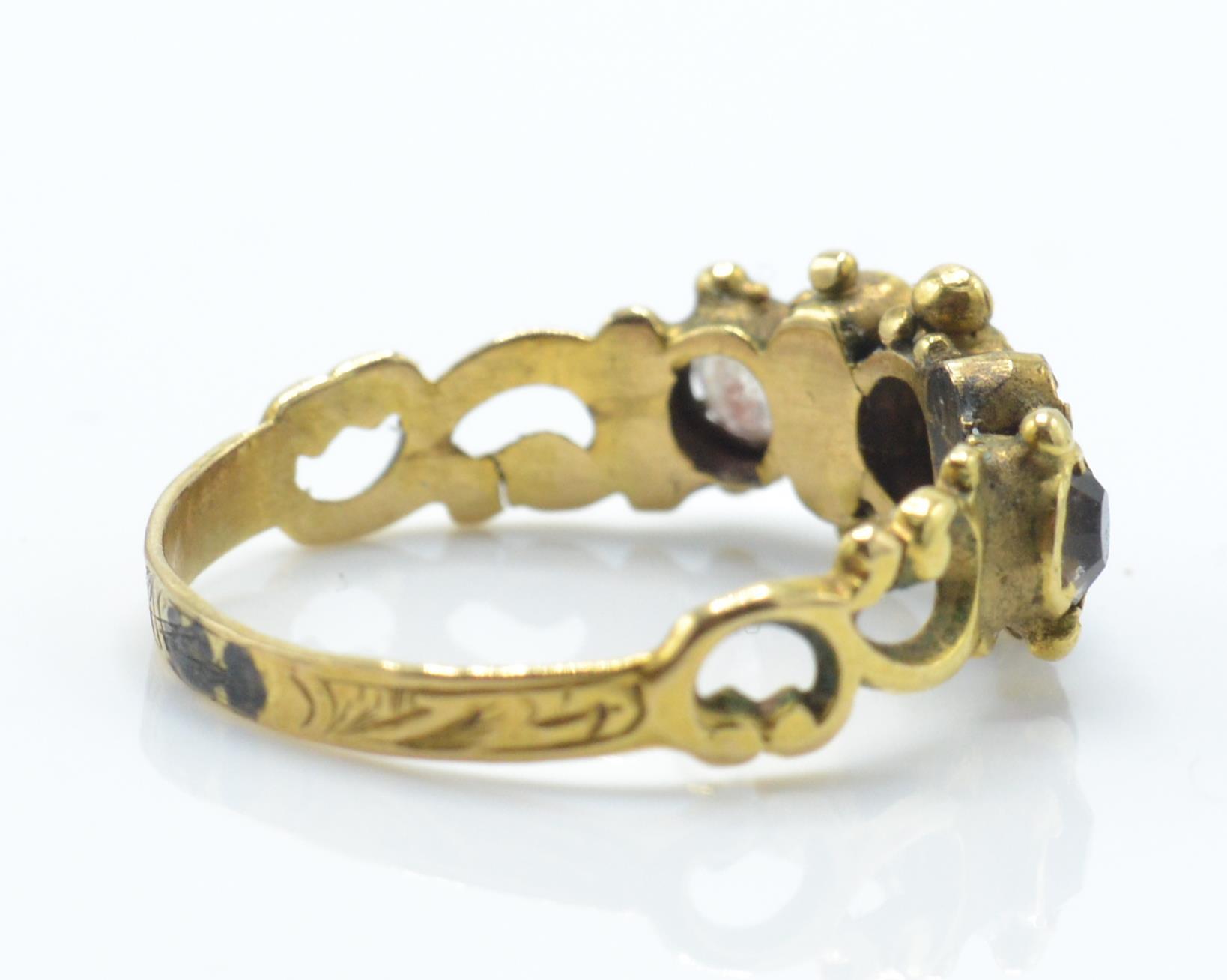 An antique gold ruby and coloured stone ring. The ring being set with ruby, white and red and pink - Image 4 of 4