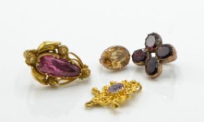 A collection of gold and gem set pendant bale drops to include pink and yellow topaz