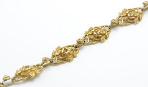 A French gold Art Nouveau seven link bracelet. The bracelet form of openwork links in the form of